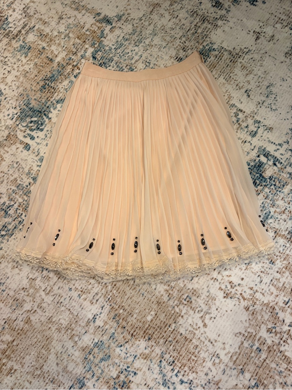 Victoria's Secret Pleated Lace-Hem Skirt in Peach with black embellishments